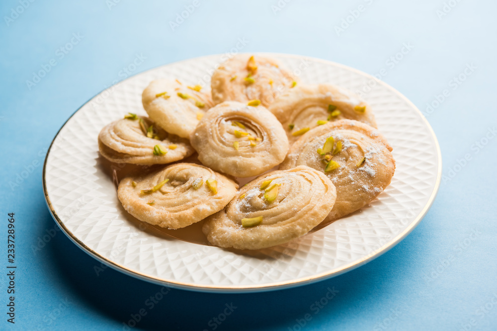 Chirote or Chiroti is a sweet dish from Karnataka and Maharashtra. Served in a plate as a dessert on Festivals or wedding. Selective focus Chirote or Chiroti is a sweet dish from Karnataka and Maharashtra. Served in a plate as a dessert on Festivals or wedding. Selective focus
