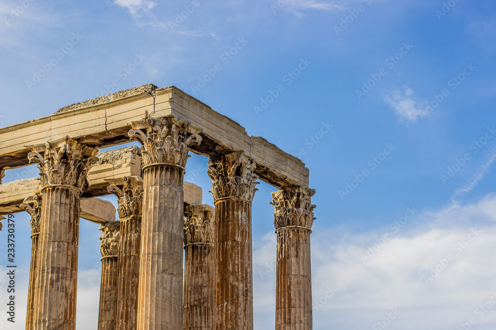 marble columns shape in golden yellow color from evening sunset sun light on blue sky background with empty space for copy or text