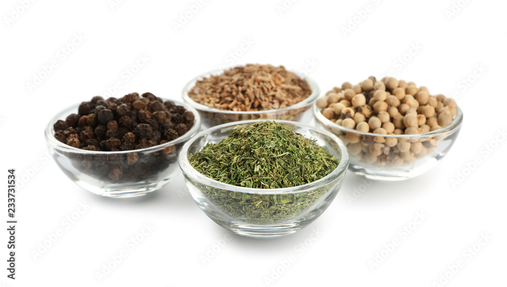 Glass bowls with different spices on white background Glass bowls with different spices on white background