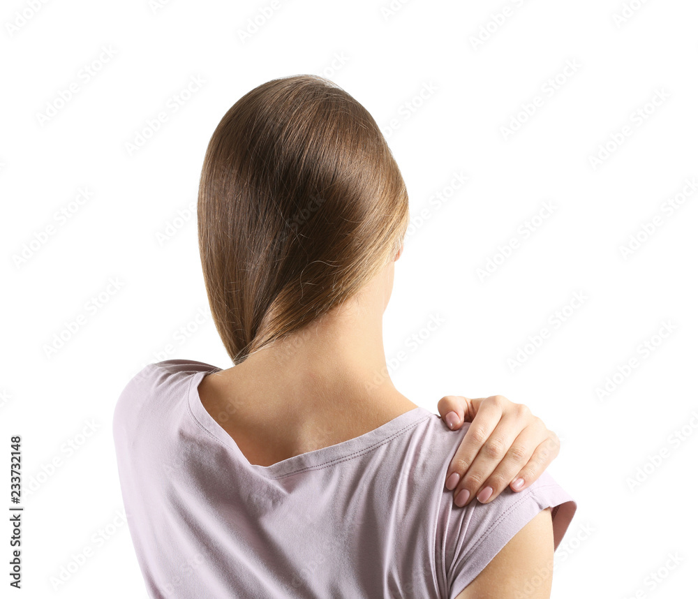 Young woman suffering from pain in shoulder on white background Young woman suffering from pain in shoulder on white background