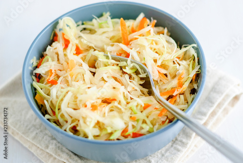 Bowl with sauerkraut and fork