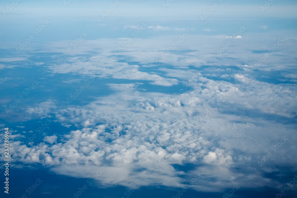 Clouds and blue sky, a view from airplane window Clouds and blue sky, a view from airplane window