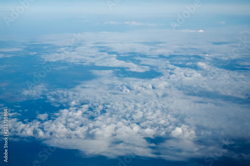 Clouds and blue sky, a view from airplane window