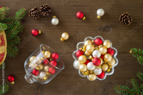 Refined Christmas composition  seen from above  with Christmas balls  reds  golden and silver  in a glass cake stand