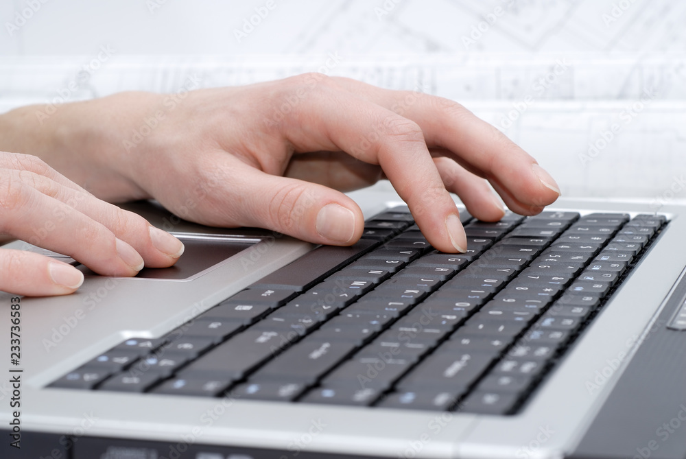 Female hands on laptop keyboard Female hands on laptop keyboard