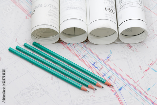 Architectural plans lying on drawing board