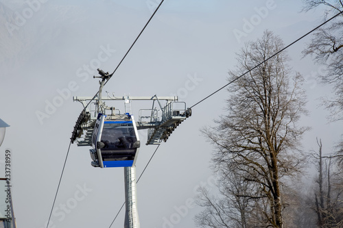 Ropeway or cable way to the foggy mountains