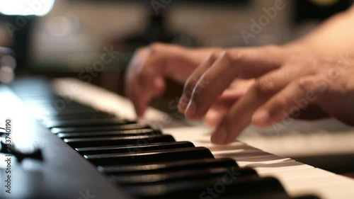 hands playing piano
