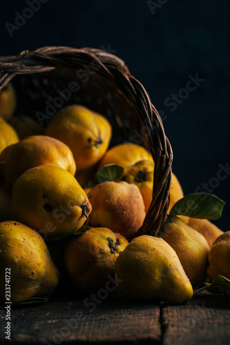 Close up of quince fruits on wooden table photo