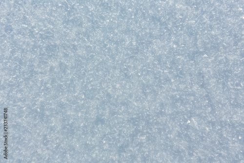 Winter snow surface with crystalline snowflakes