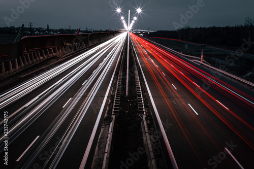 tracks from the cars lights on night road photo