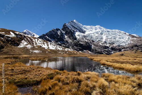 Mountains with a lagoon as seen from the Ausangate Trek in the Cordillera Vilcanota, Andes Mountains, Peru photo