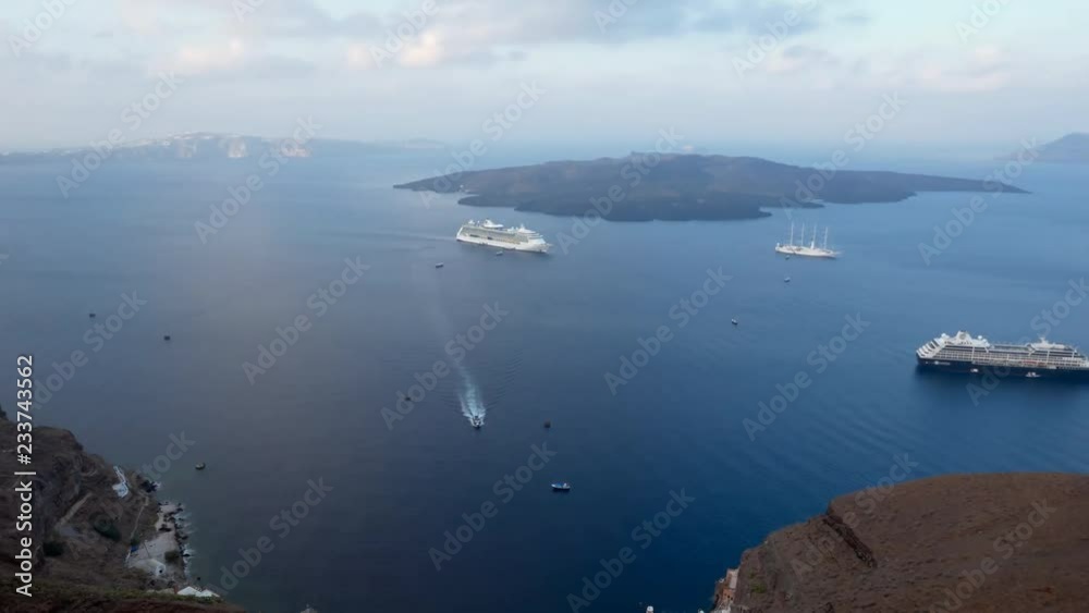 Aeiral timelapse of cruise ships and boats in Santorini island port, Greece. Aeiral timelapse of cruise ships and boats in Santorini island port, Greece.