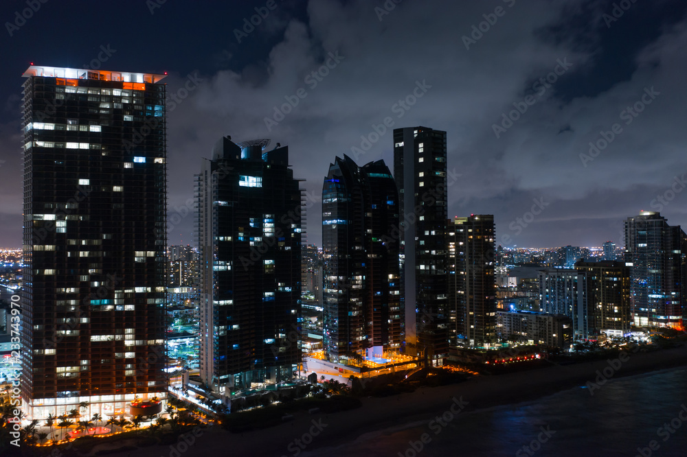 Sunny Isles Beach Florida beachfront highrise towers at night Sunny Isles Beach Florida beachfront highrise towers at night