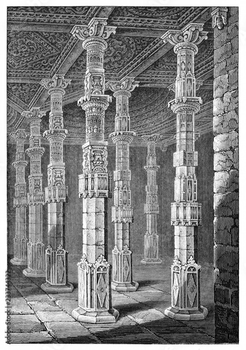 majestic high columns arabian decorated in a large stone room. Adhai Din Ka Jhonpra mosque in Ajmer Rajasthan India. Created by Andrew Best and Leloir published on Magasin Pittoresque Paris 1839 photo