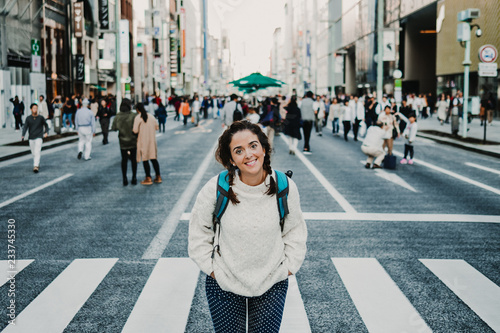 Photography .Caucasian middle-aged woman traveling through Japan. Touring the city of Tokyo
