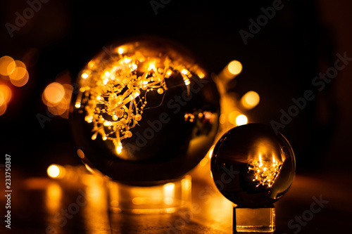 Glassballs with Christmas lights in the background. photo