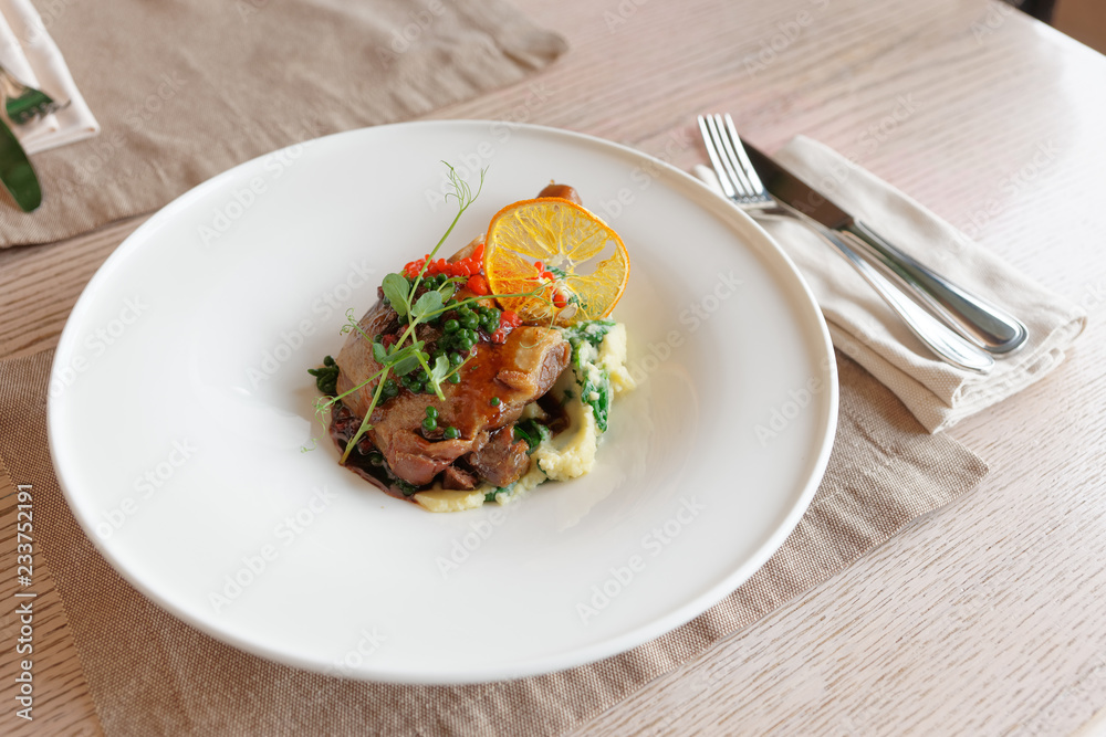 Fried duck leg with thick sauce and molecular caviar Fried duck leg with thick sauce and molecular caviar