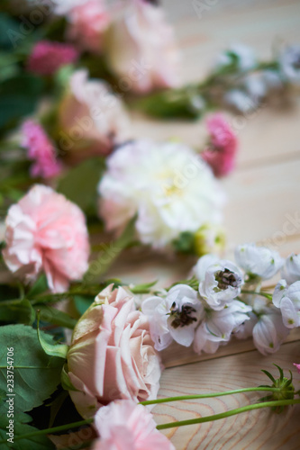 young flowers on rustic wooden boards background