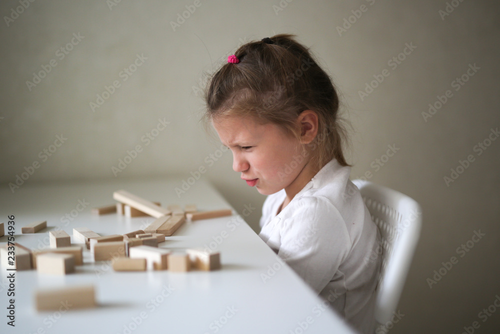 one frustrated child plays constructor at table one frustrated child plays constructor at table