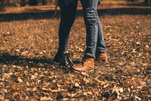 Classy couple in jeans in the wood