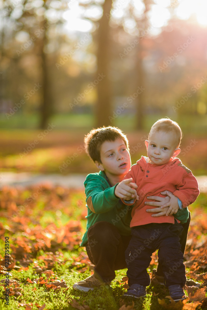 Adorable brothers children hugging each other outside Adorable brothers children hugging each other outside