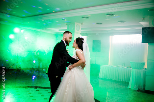 Amazing first dance of newlyweds in green smoke