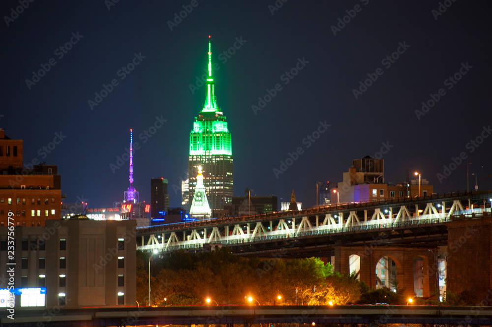 The Empire State Building illuminated in Green at night