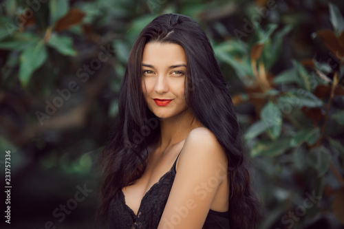 Summer girl portrait. Asian woman smiling happy on sunny summer or spring day outside in park Pretty mixed race Caucasian Asian young woman looking at camera outdoors.