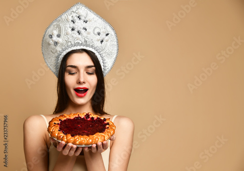 Beautiful fashion girl with delicious berry pie