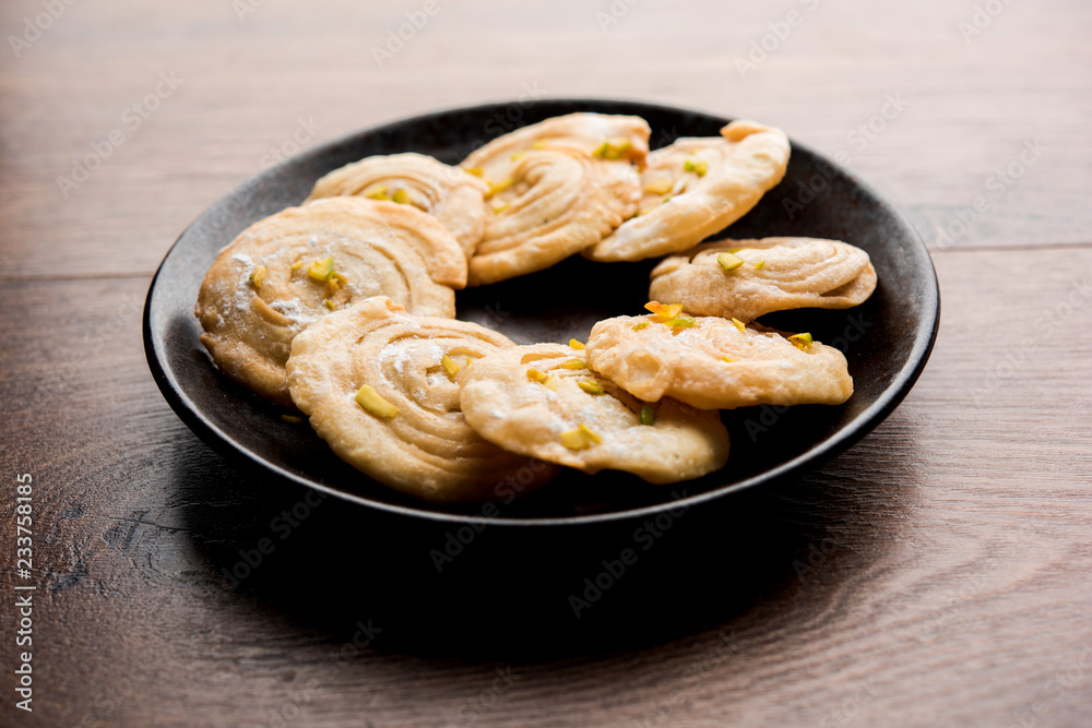 Chirote or Chiroti is a sweet dish from Karnataka and Maharashtra. Served in a plate as a dessert on Festivals or wedding. Selective focus Chirote or Chiroti is a sweet dish from Karnataka and Maharashtra. Served in a plate as a dessert on Festivals or wedding. Selective focus
