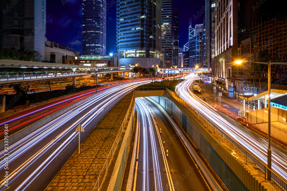 abstract traffic light tail in cityscape night skyline and buildings abstract traffic light tail in cityscape night skyline and buildings