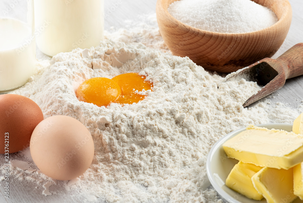 Ingredients for dough and pastry on wooden table Ingredients for dough and pastry on wooden table