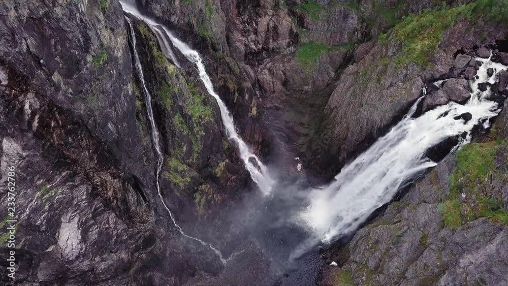 Aerial flyover shot of Voringfossen waterfall in Norway Aerial flyover shot of Voringfossen waterfall in Norway