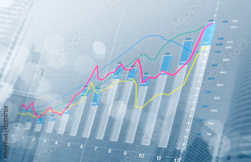 Business growth, progress or success concept. Financial bar chart and growing graphs with depth of field on bright tone background.