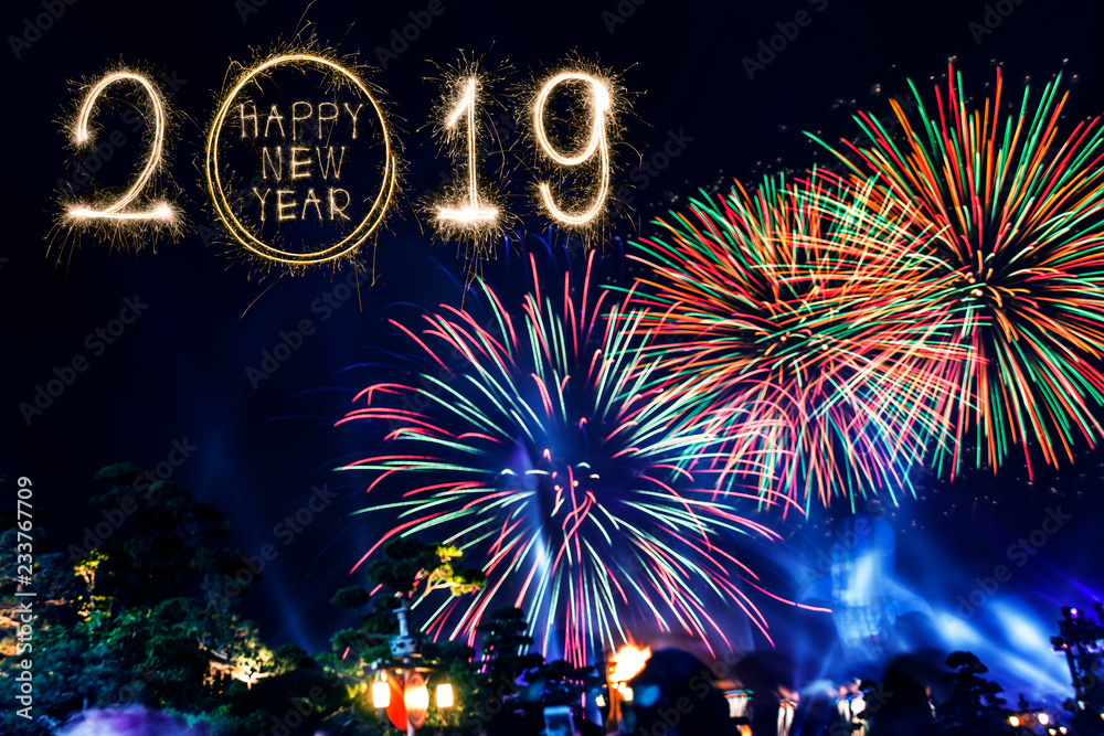 Obraz premium Happy new year 2018 text written with Sparkle fireworks isolated on black background