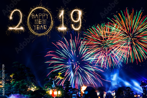 Happy new year 2018 text written with Sparkle fireworks isolated on black background