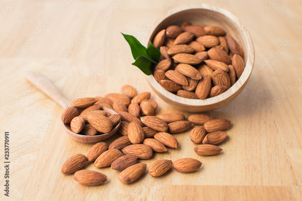 almond on wooden table. soft focus. almond on wooden table. soft focus.
