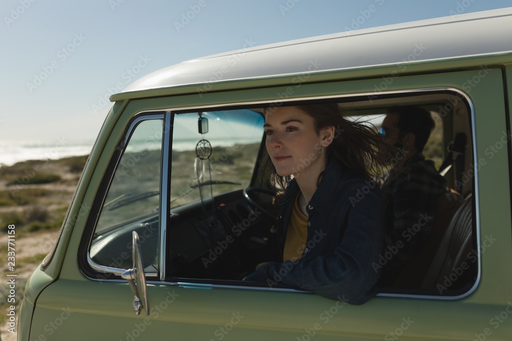 Woman looking through car window Woman looking through car window