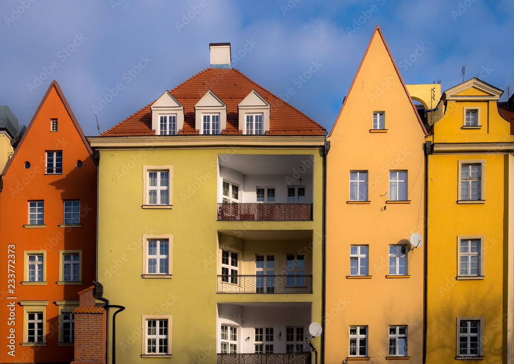 Colorful polish apartment buildings with pointy roofs