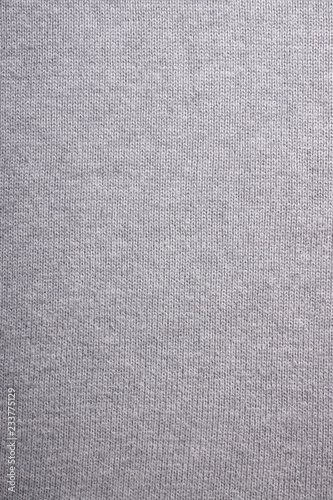 gray knitted background, close-up of grey knitwear sweater