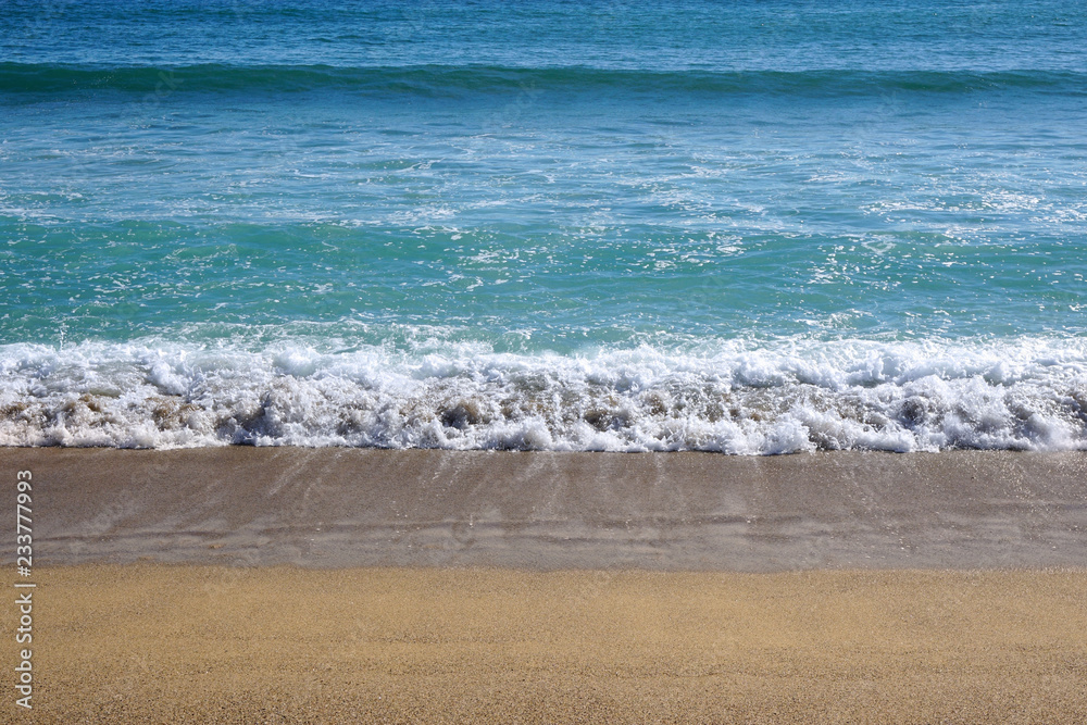 seaside background, ocean wave on sandy beach                   