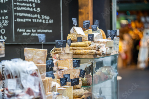LONDON, UK - NOVEMBER 13, 2018 - Cheese and other quality Italian products such as Salami at London's famous markets located near the Borough Market photo