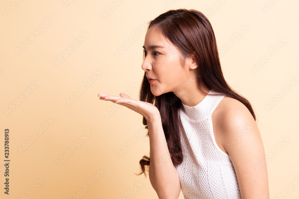 Beautiful young Asian woman blow a kiss. Beautiful young Asian woman blow a kiss.