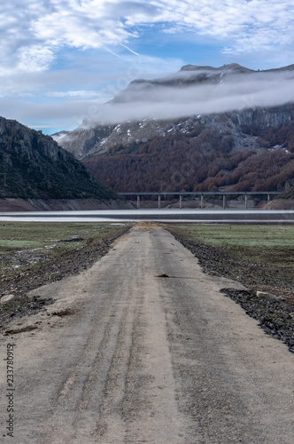 Vertical photo of the river crossing the valley direction reservoir in a frosty morning, in general under the waters of the Riaño reservoir in Leon (Spain). Fantastic view of the river and valley area photo