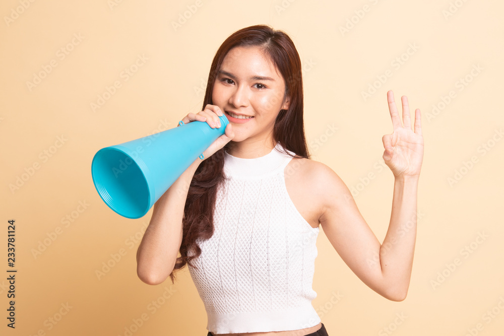 Beautiful young Asian woman show OK announce with megaphone. Beautiful young Asian woman show OK announce with megaphone.