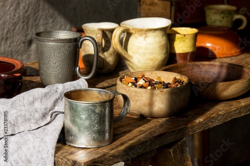 Mugs and tin cups.