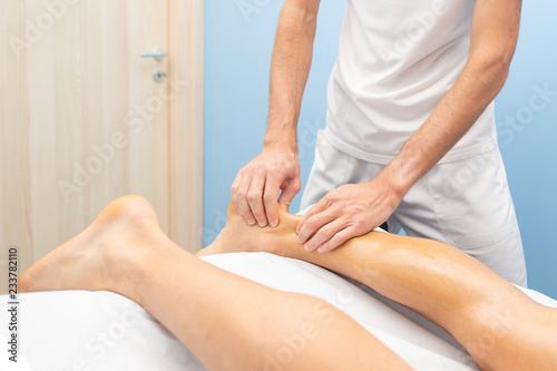 Physiotherapist during an Achilles tendon treatment