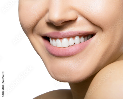 Smiling happy woman. Laughing female mouth with great teeth over white background. Healthy beautiful smile. Teeth health, whitening, prosthetics and care.