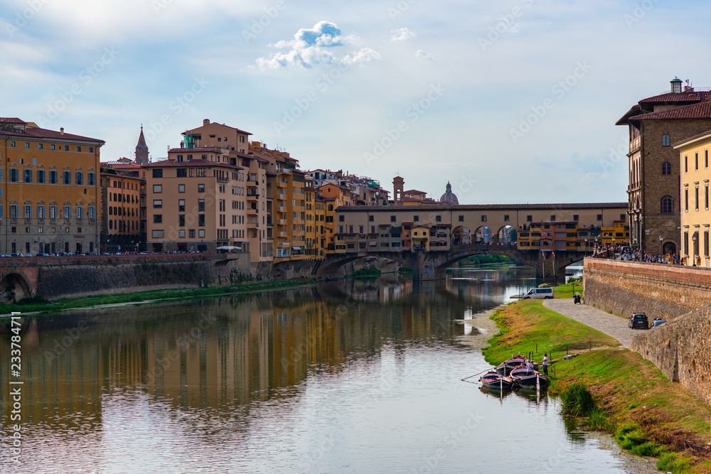 Obraz premium Ancient city center, Florence, Tuscany, Italy. Varicoloured beautiful building in ancient European town. Arno river bank and Old Bridge, Florentine amazing landscape.